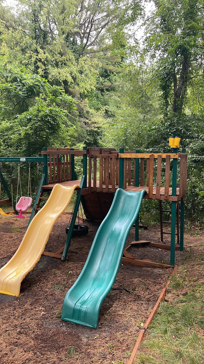 Wooden play set with a slide and swing set, cleaned and refinished, West Bloomfield MI