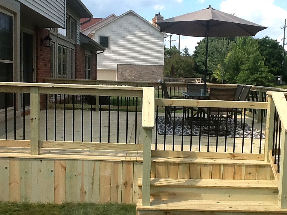 Pressure-treated deck with patio furniture in Chelsea, MI