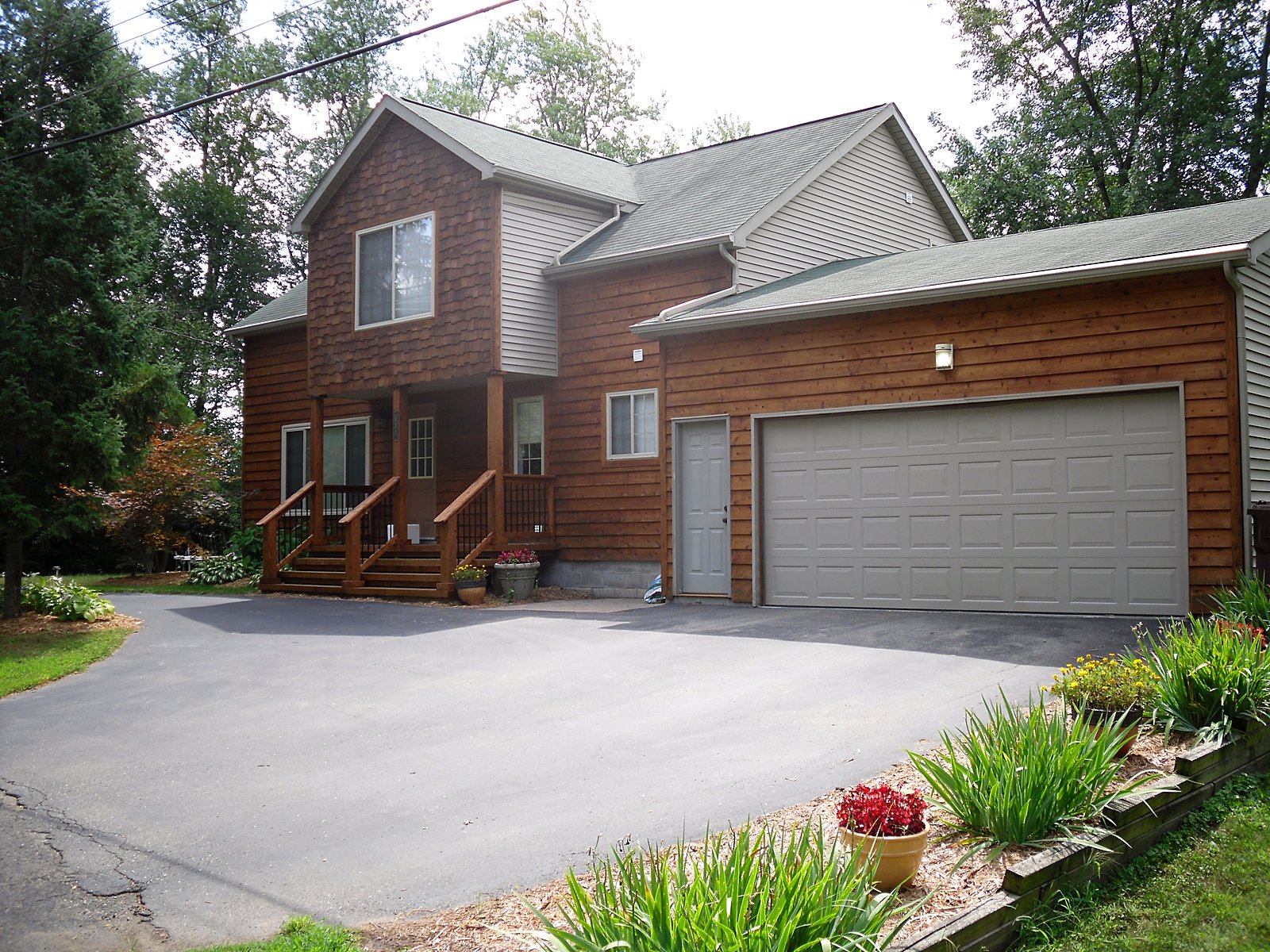 Cedar-sided home with new deck in Clarkston, MI
