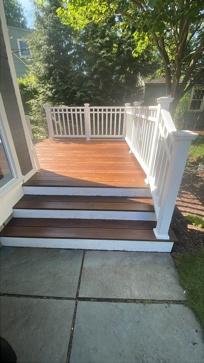 Deck with a pergola frame and glossy finish in Commerce, MI