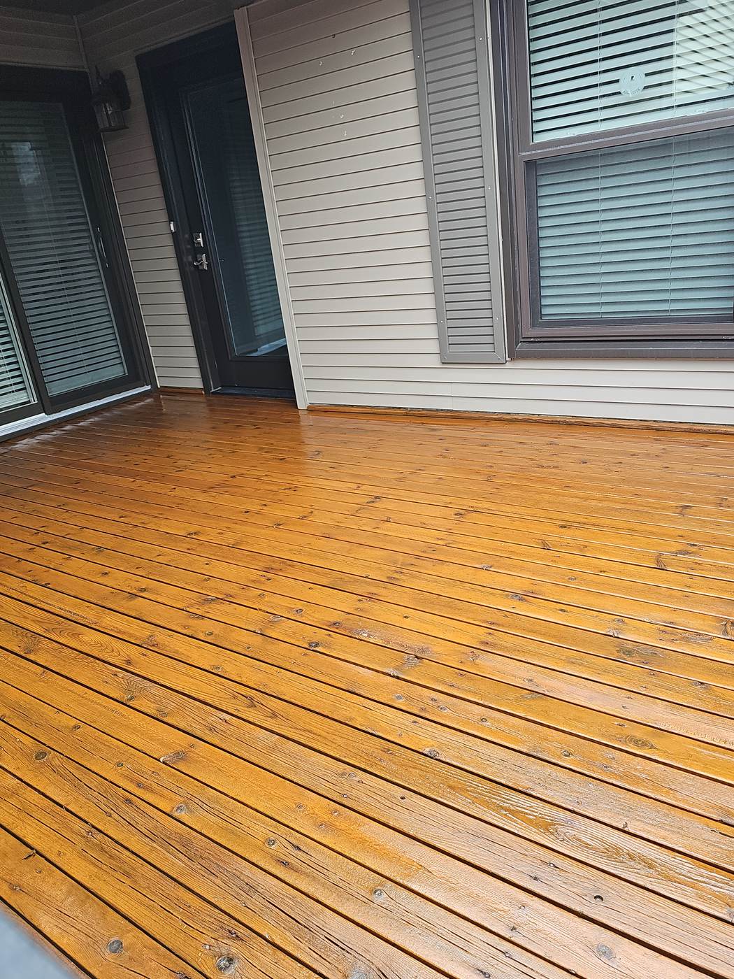 Close-up of freshly stained wood decking and siding in Farmington, MI