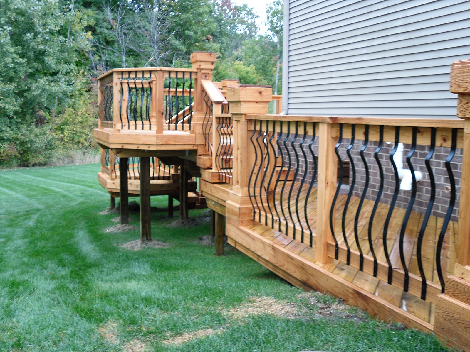 Elevated deck with wrought iron rail in Fenton, MI