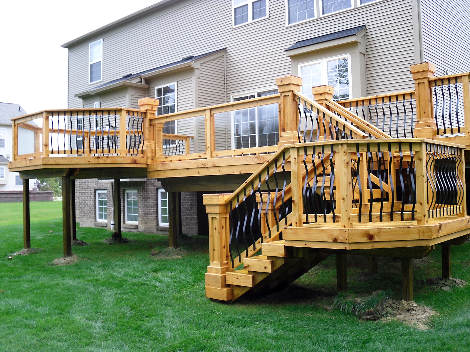 Deck with wrought iron rail in Fenton, MI
