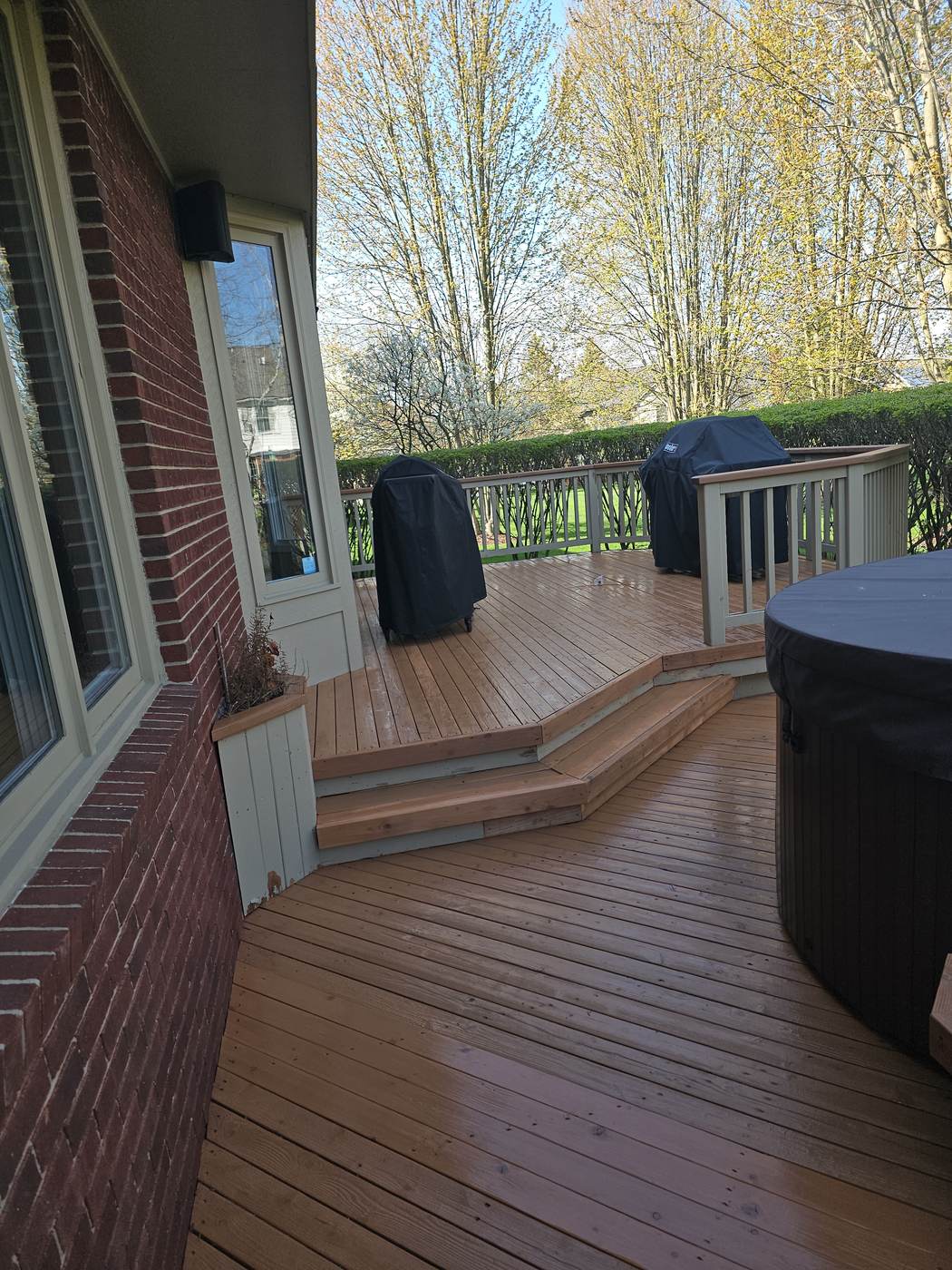 Aerial view of a deck against a brick and siding home in Grosse Pointe Shores, MI