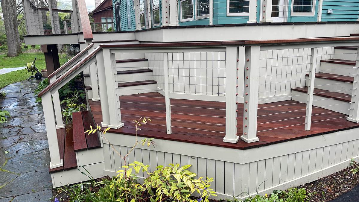 Multi-level deck with railings and stained decking on a Victorian-style home in Grosse Pointe Woods, MI