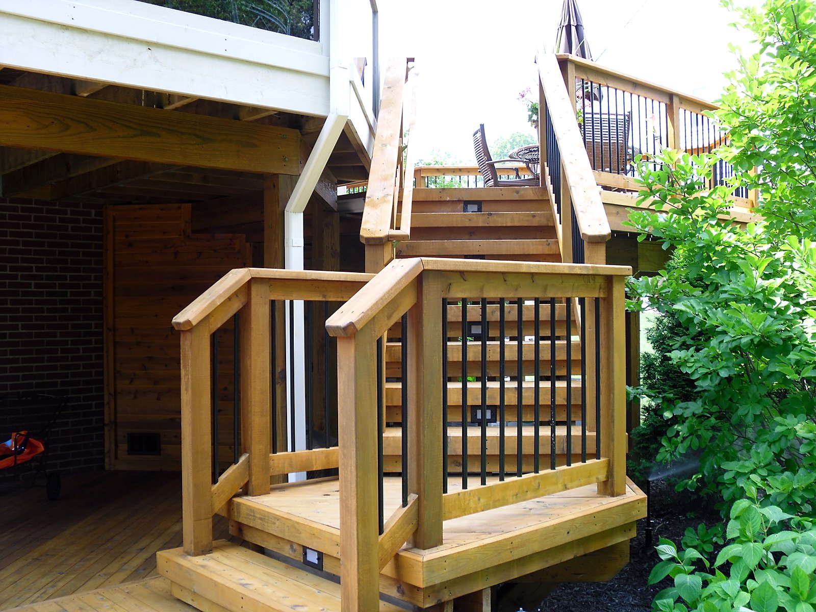 Elevated deck with covered patio below in Novi, MI