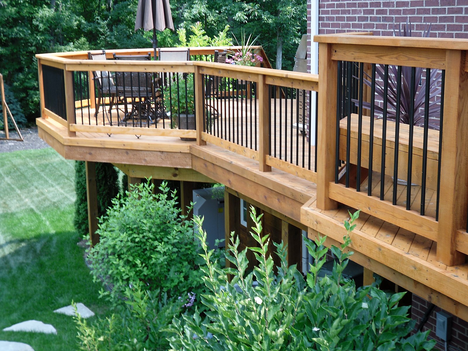 Re-stained cedar deck with black rail in Southeast Michigan