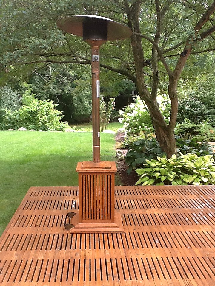 Freshly stained deck with patio heater stand in Southeast Michigan