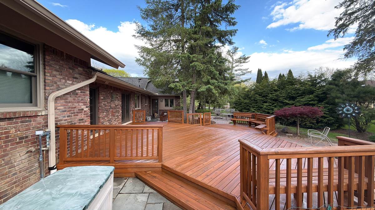 Wraparound deck on a brick ranch home in Utica, MI