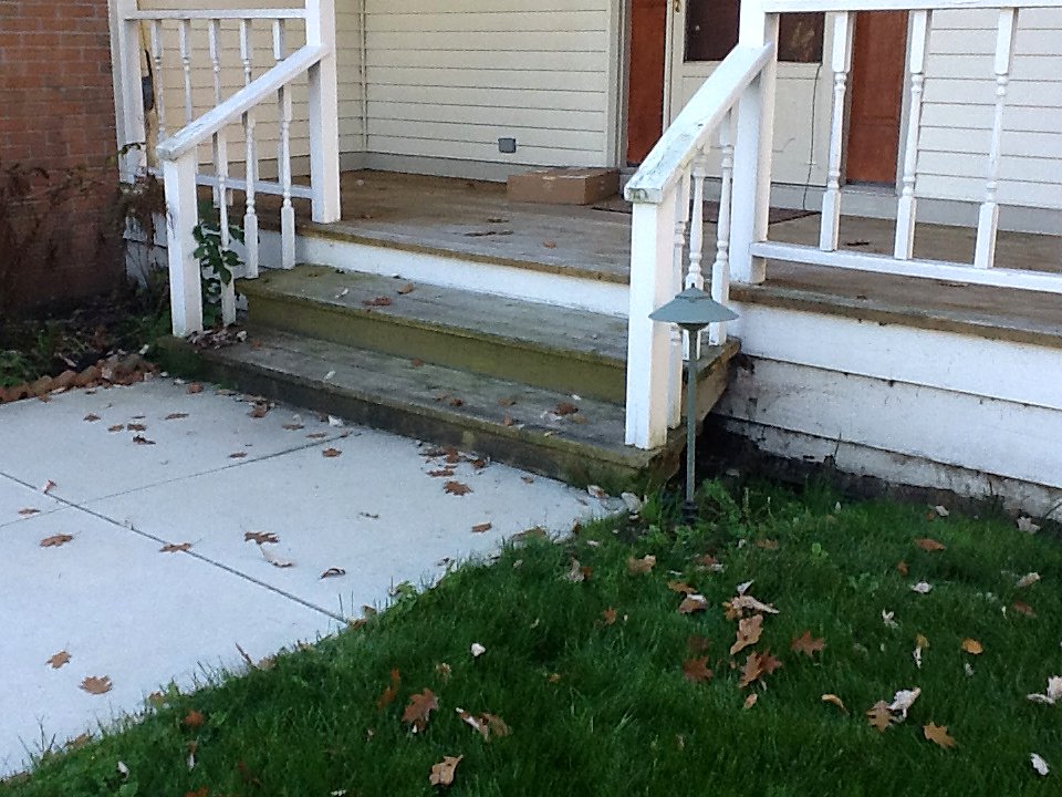Worn wood steps before restoration in Hartland, MI