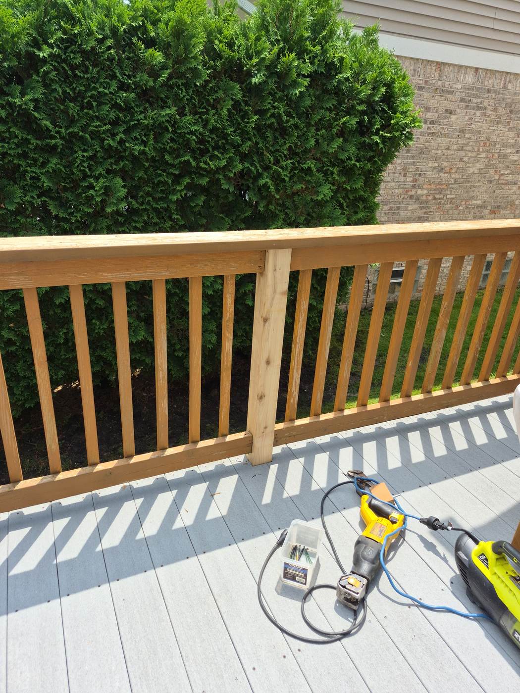 Aerial view of a new deck walkway under construction leading to a backyard patio in Village of Clarkston, MI