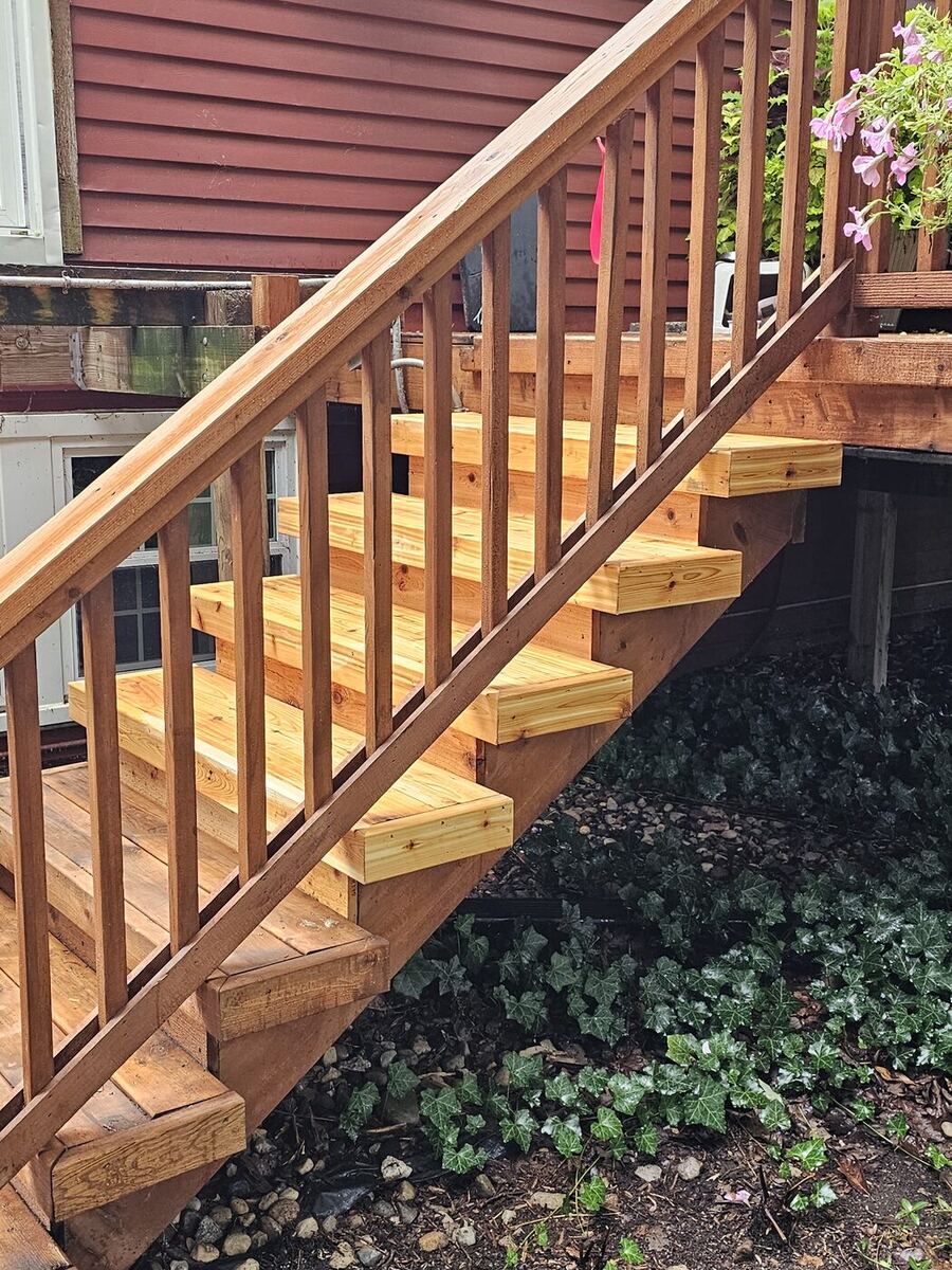 Rebuilt deck staircase with new cedar treads on the existing stained rail structure, Canton MI