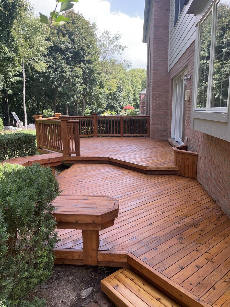 Finished multi-level deck with a rich, hand-brushed brown stain, South Lyon MI